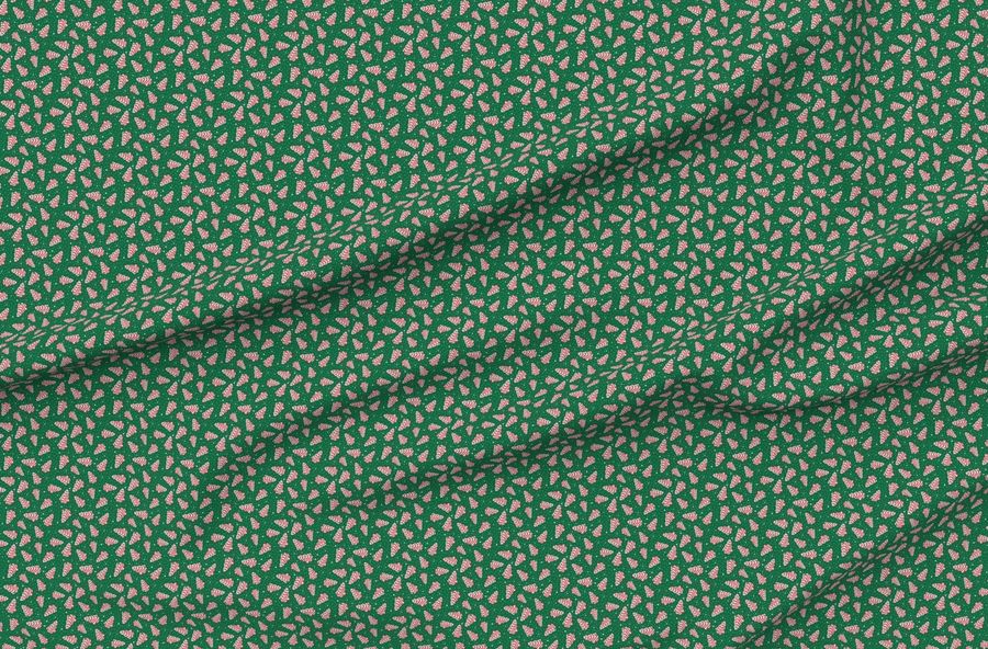 Small Scale Christmas Tree Frosted Snack Cakes On Emerald Green