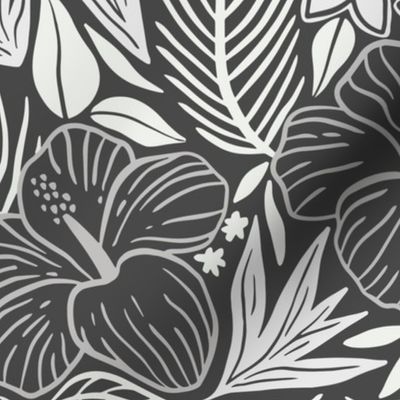 Tropical leaves and flowers in grey tones