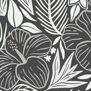 Tropical leaves and flowers in grey tones