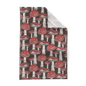 Pattern with red fly agaric on brown background