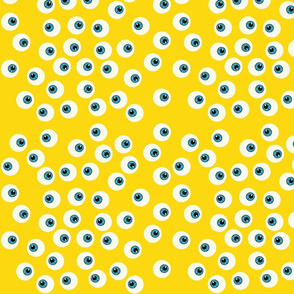 Blue Eyeballs on Yellow Background