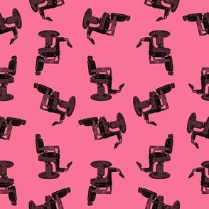 Antique Barber's Chair in Black on Coral Pink Background