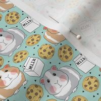 small pastel guinea pigs with milk and cookies