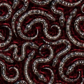 SMALL NEST OF SNAKES METALLIC EFFECT ON RED FLWRHT