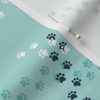 Small scale // Hot dogs chase // aqua background navy blue and white paw prints