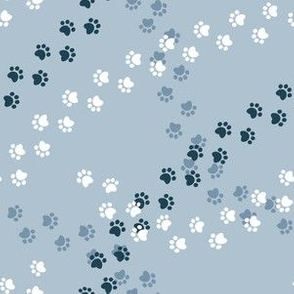 Small scale // Hot dogs chase // pastel blue background navy blue and white paw prints