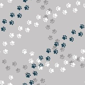 Small scale // Hot dogs chase // grey background navy blue and white paw prints