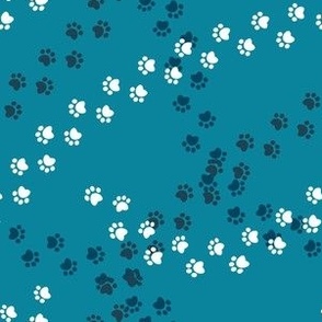 Small scale // Hot dogs chase // turquoise background navy blue and white paw prints