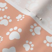 Small scale // Paw prints // flesh coral background white animal foot prints