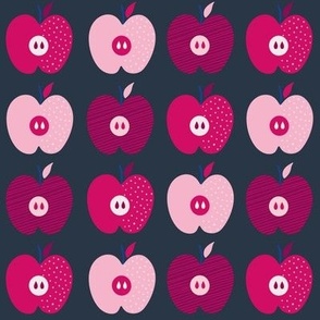 Apples, red and pink on dark background