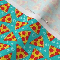 tiny pepperoni pizza slices on teal