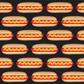 small hot dogs on black