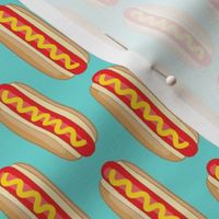 vertical hot dogs on teal