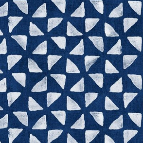 Block Print Triangles on Indigo Blue (large scale) | Pinwheel triangles from hand carved block, white on deep navy blue.