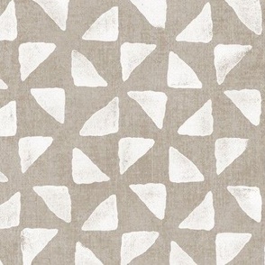 Block Print Triangles on Ecru (xl scale) | Pinwheel triangles from hand carved block, white on sandy beige.