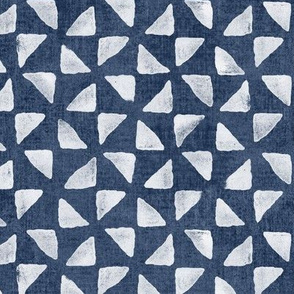 Block Print Triangles on Blue Grey Denim (large scale) | Pinwheel triangles from hand carved block, white on faded denim.