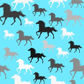 Running wild horses on blue