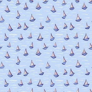 Sail boats in red and white stripes on a blue sea