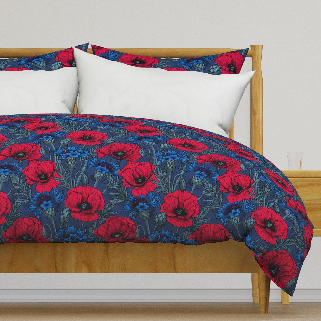 Red poppies and blue cornflowers on blue