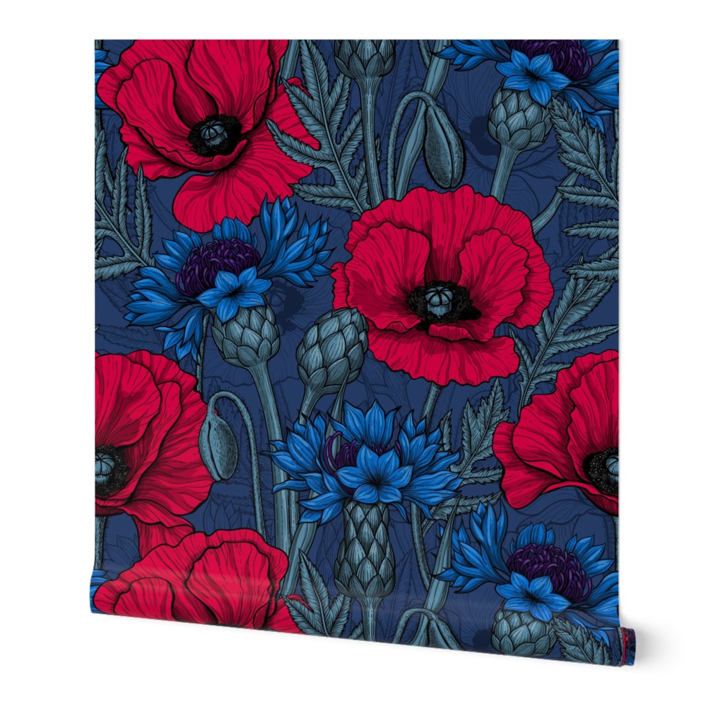 Red poppies and blue cornflowers on blue