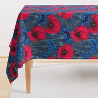 Red poppies and blue cornflowers on blue