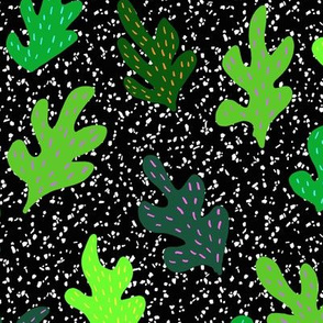 Green bright leaves with neon accents on speckles