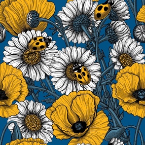 The meadow in blue and yellow, ladybugs on daisy and poppy flowers