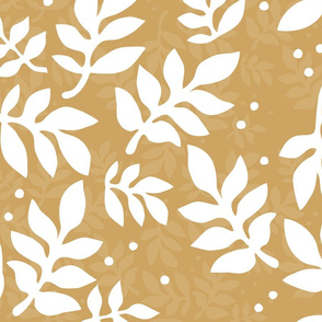 white bold leaves on sandy yellow