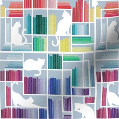 Small scale // Rainbow bookshelf // pastel blue background white book shelves and library cats