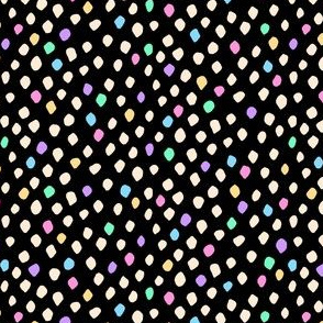 Cream and rainbow pastel spots on black