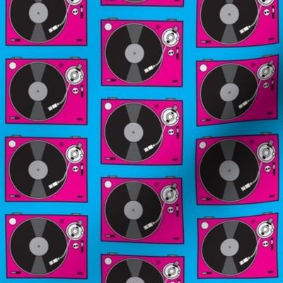 large fuchsia turntables on blue