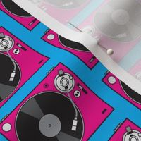 large fuchsia turntables on blue