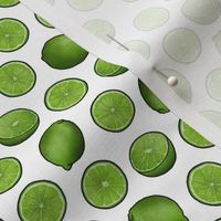 Green lime citrus slices on white