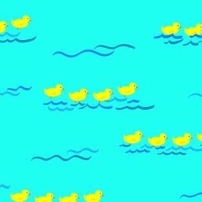 duckies paddling on water ripples
