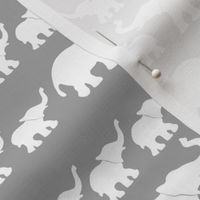 marching elephant mama and babies in white on gray