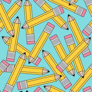 large yellow pencils on teal