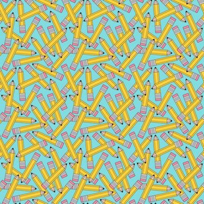 small yellow pencils on teal