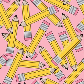 large yellow pencils on pink