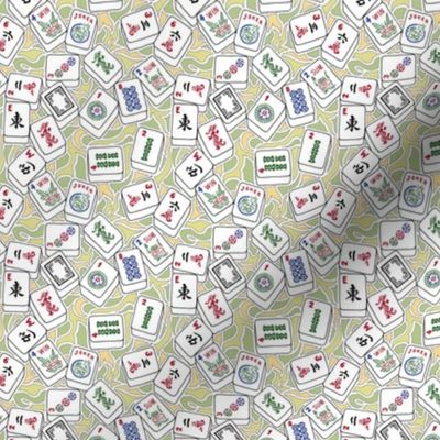 Mini Scale Mahjong Tiles on Yellow and Green Swirls Background