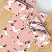 Large scale cranes on blush pink