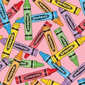 large random crayons on pink