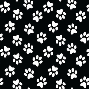 miniature paw prints on black designer fabric from the USA pure