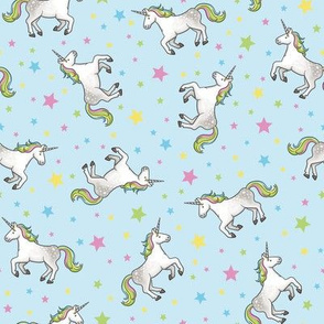 Rainbow Unicorns and Stars, scattered on light blue – medium scale