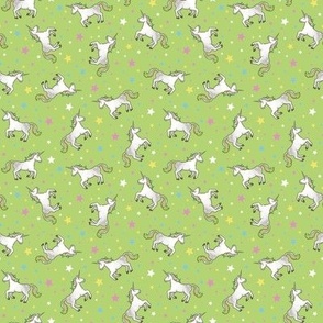 Rainbow Unicorns and Stars, scattered on pea greeen – small scale