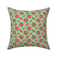 Pink red vintage style roses on green (small)