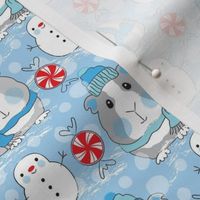 medium guinea pigs snowmen and candy on blue
