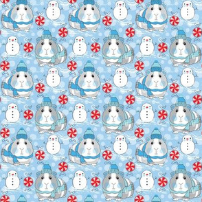 small guinea pigs snowmen and candy on blue