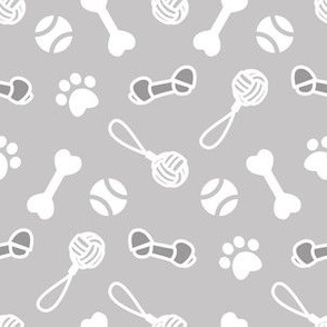 Small scale // Fetch play and chew // white background grey bones balls pet toys and paw prints