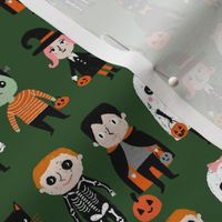 trick or treat - cute halloween kids in costumes fabric - dark green