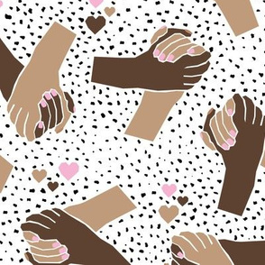 Black Lives Matter hand in hand against racism friendship and love white brown pink